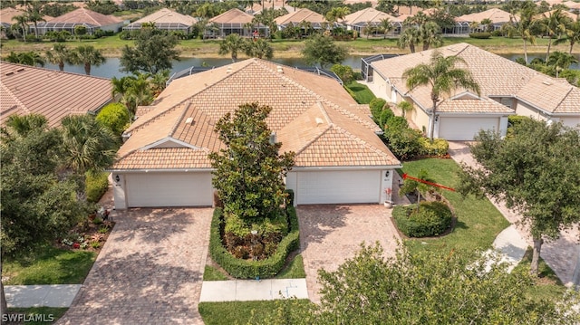 birds eye view of property featuring a water view