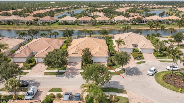 birds eye view of property featuring a residential view and a water view