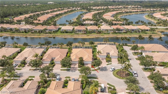 bird's eye view featuring a water view and a residential view