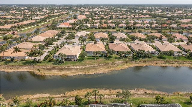 birds eye view of property featuring a residential view and a water view