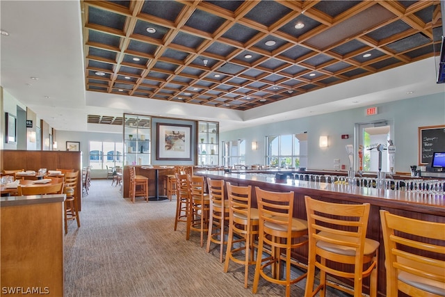 bar with a community bar, carpet, and coffered ceiling