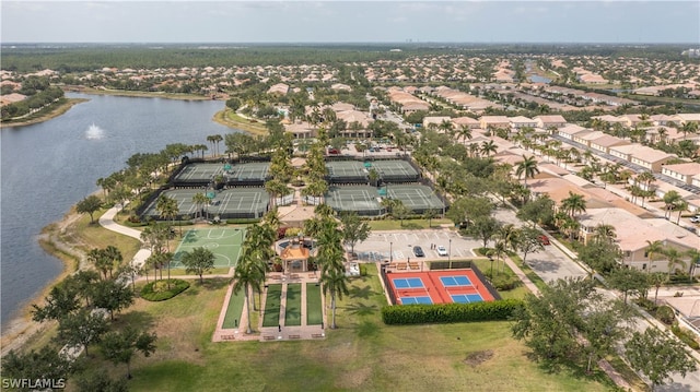 bird's eye view with a residential view and a water view