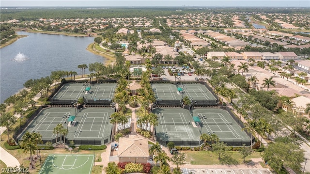 drone / aerial view with a water view and a residential view