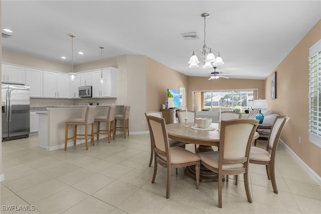 dining room featuring light tile patterned floors, recessed lighting, ceiling fan with notable chandelier, visible vents, and baseboards