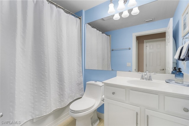 bathroom featuring vanity and toilet