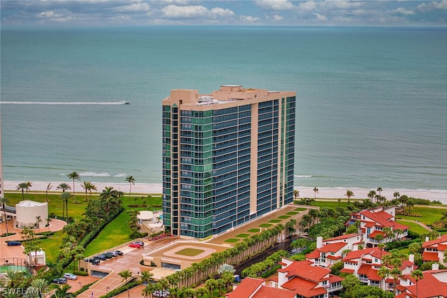 aerial view with a water view and a view of the beach