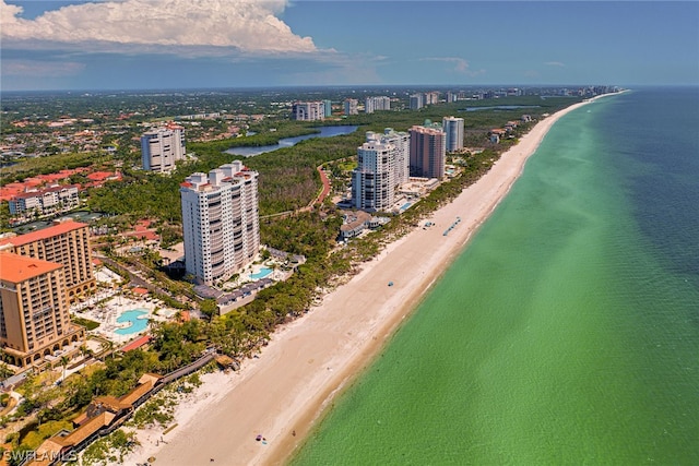 birds eye view of property with a view of the beach and a water view