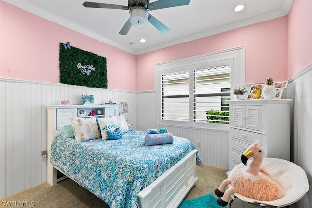 carpeted bedroom with crown molding and ceiling fan