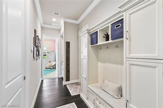 mudroom with ornamental molding and dark hardwood / wood-style floors