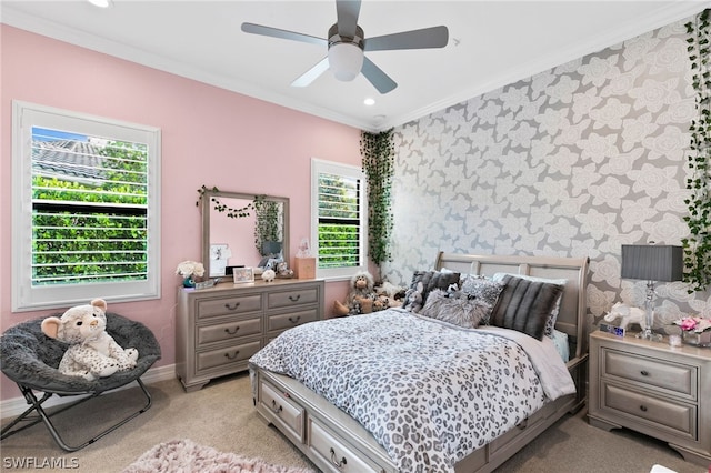 bedroom featuring crown molding, ceiling fan, and light carpet