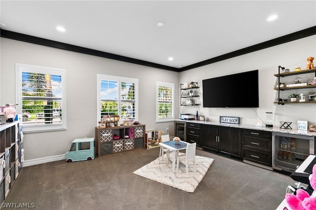 living room with dark carpet and crown molding