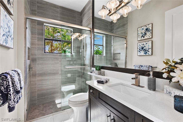 bathroom featuring vanity, an enclosed shower, tile patterned floors, and toilet