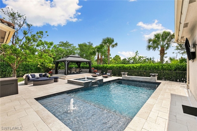 view of swimming pool featuring pool water feature, a patio area, a gazebo, an in ground hot tub, and an outdoor living space