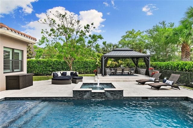 view of swimming pool featuring a gazebo, pool water feature, outdoor lounge area, and a patio area