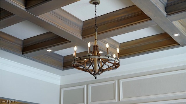 room details featuring crown molding, coffered ceiling, beam ceiling, and a notable chandelier