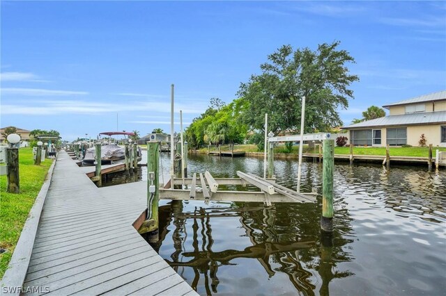 view of dock with a water view