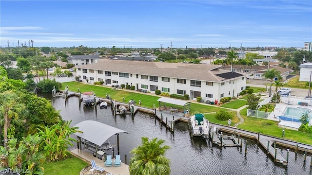 bird's eye view featuring a water view and a residential view