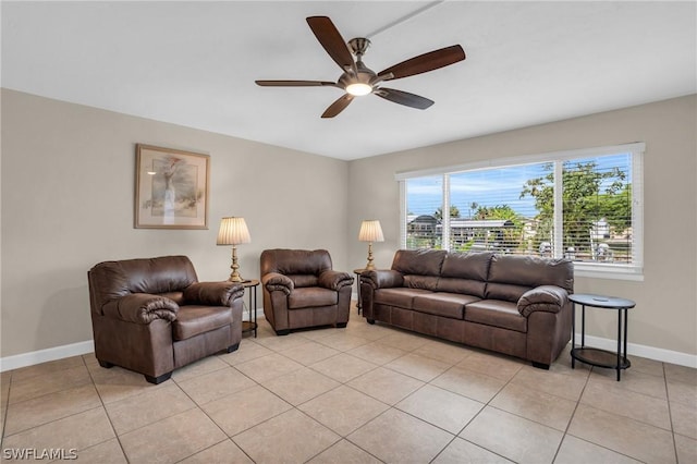 tiled living room featuring ceiling fan