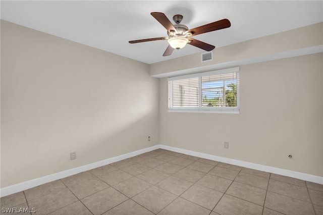 unfurnished room with light tile patterned floors and ceiling fan