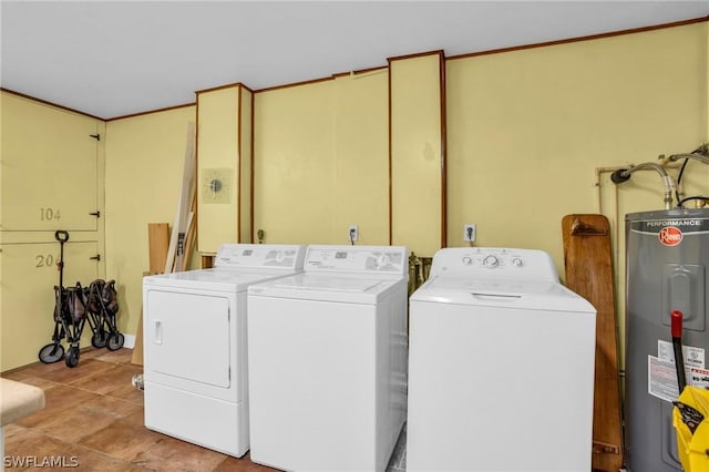 laundry area with independent washer and dryer, electric water heater, and light tile patterned floors