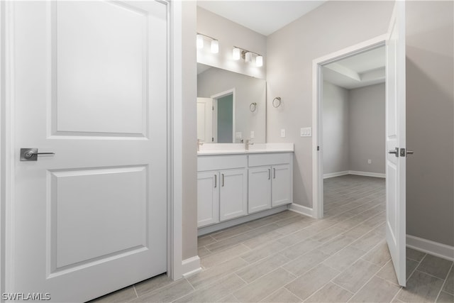 bathroom featuring tile floors and large vanity