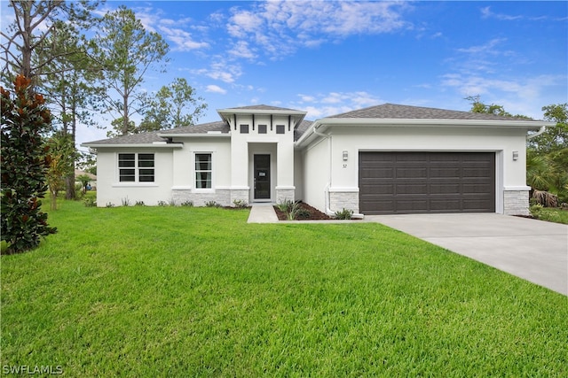 prairie-style house featuring a garage and a front yard