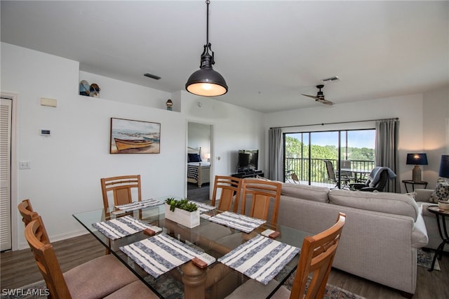 dining area featuring dark hardwood / wood-style flooring and ceiling fan