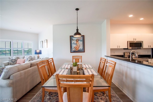 dining room with wood-type flooring