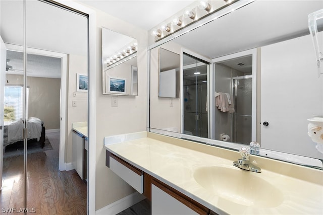 bathroom featuring hardwood / wood-style flooring and vanity