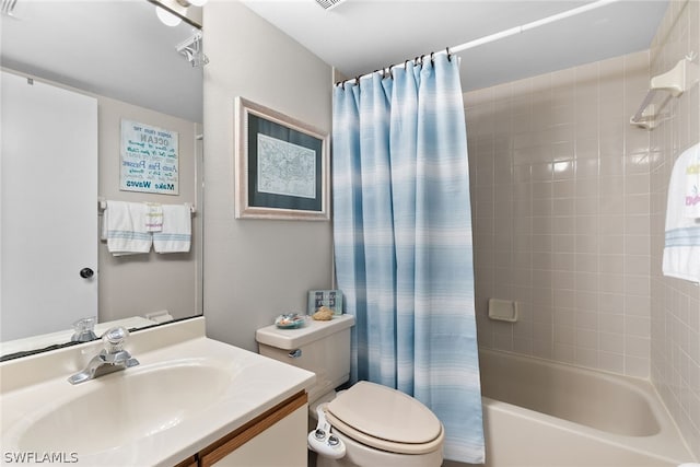 full bathroom with shower / bath combo with shower curtain, toilet, and vanity