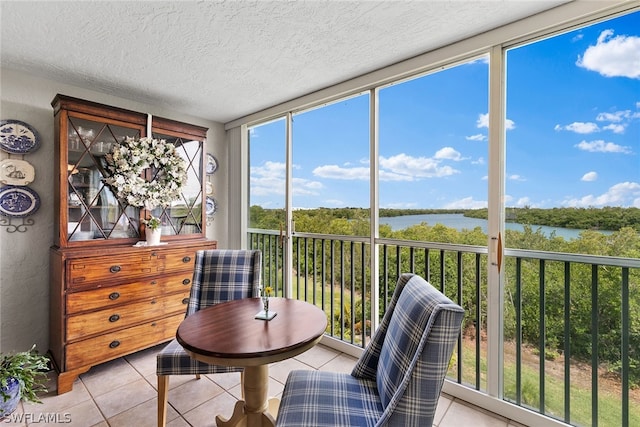 sunroom / solarium with a water view