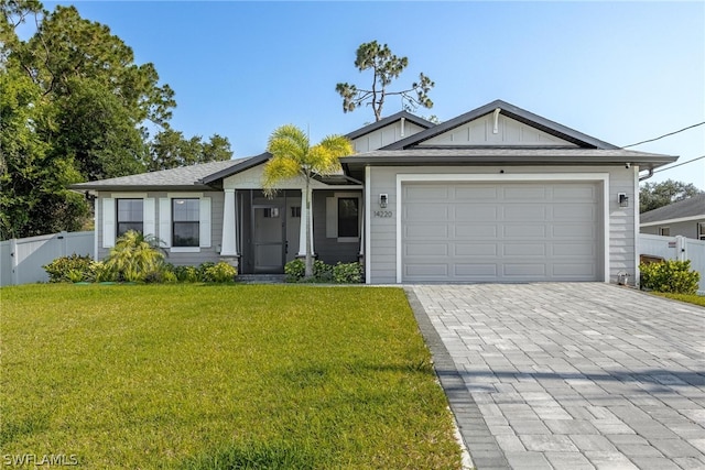 ranch-style house with a garage and a front yard