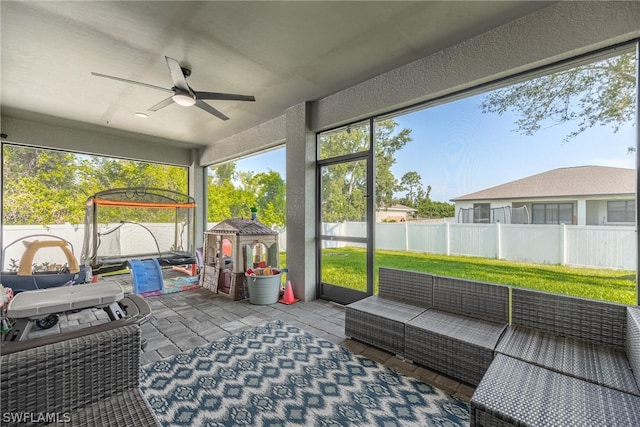 sunroom / solarium with ceiling fan