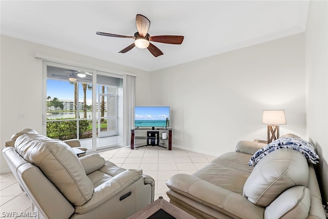 living room featuring ornamental molding, ceiling fan, and light tile flooring