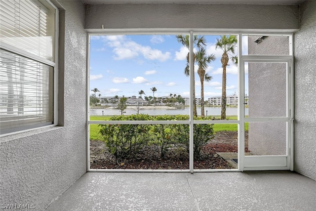 unfurnished sunroom with a wealth of natural light