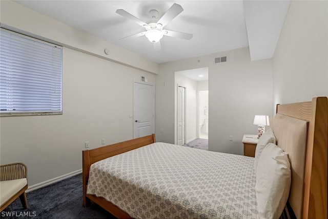 carpeted bedroom featuring connected bathroom, a closet, and ceiling fan