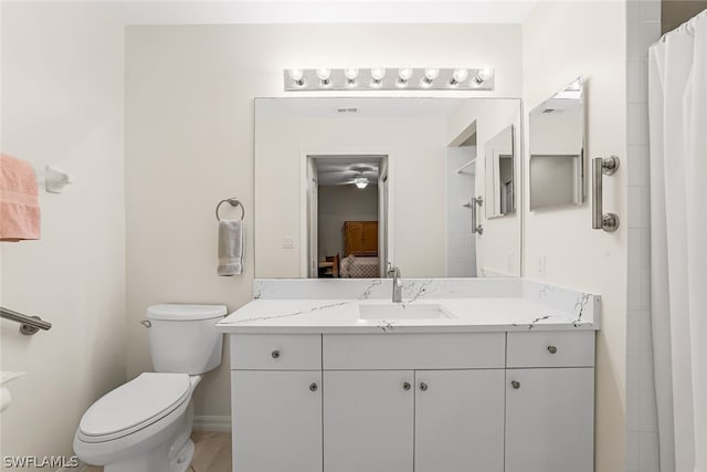 bathroom featuring toilet and vanity