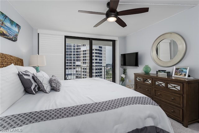 bedroom with ceiling fan, a wall of windows, light carpet, and access to exterior