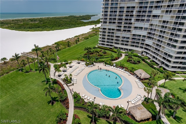 view of swimming pool featuring a water view