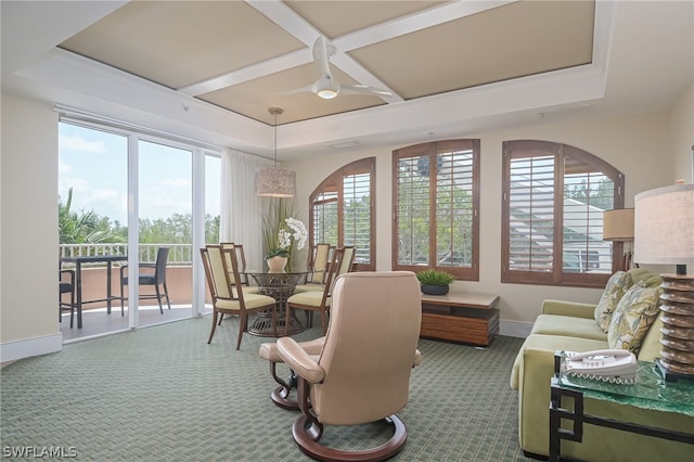 living room featuring a wealth of natural light, carpet, and ceiling fan