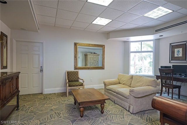 living room with a paneled ceiling