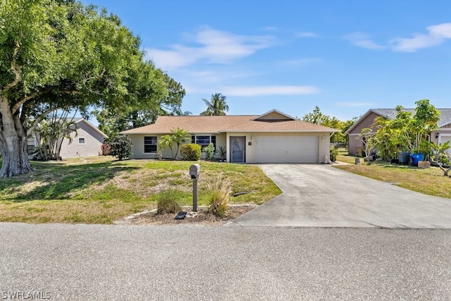 ranch-style home featuring a front lawn and a garage