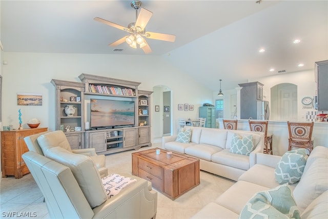 tiled living room featuring vaulted ceiling and ceiling fan