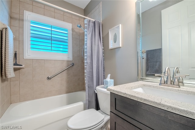 full bathroom featuring shower / bath combo with shower curtain, oversized vanity, and toilet