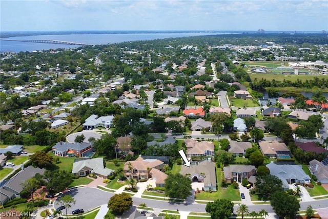 birds eye view of property with a residential view and a water view