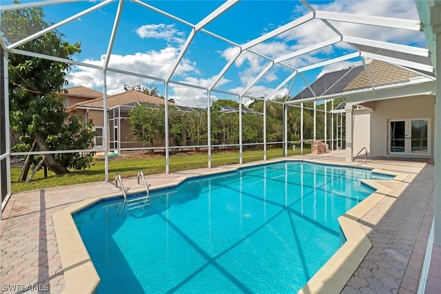 outdoor pool featuring french doors, glass enclosure, and a patio