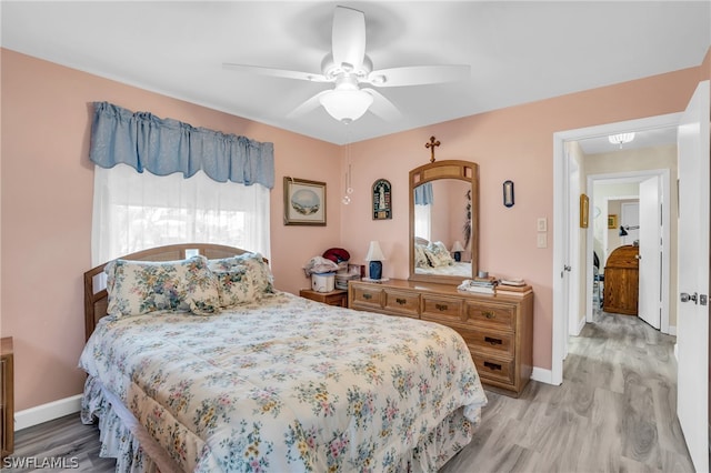 bedroom featuring ceiling fan and hardwood / wood-style floors