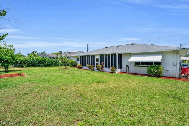 view of yard with a sunroom