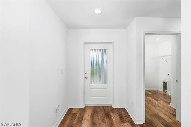 entryway with dark wood-type flooring