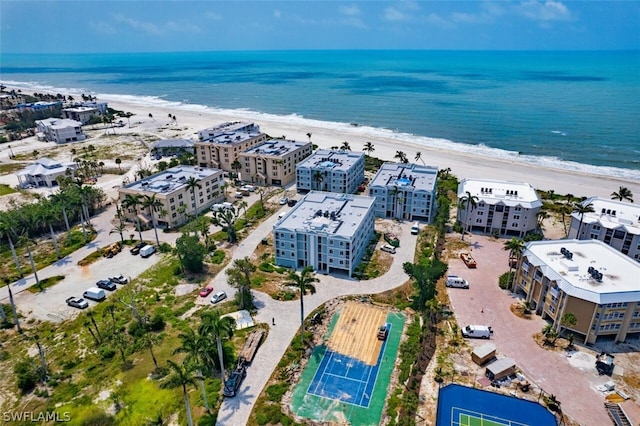 drone / aerial view featuring a view of the beach and a water view